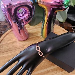 Rose gold tone infinity adjustable bracelet